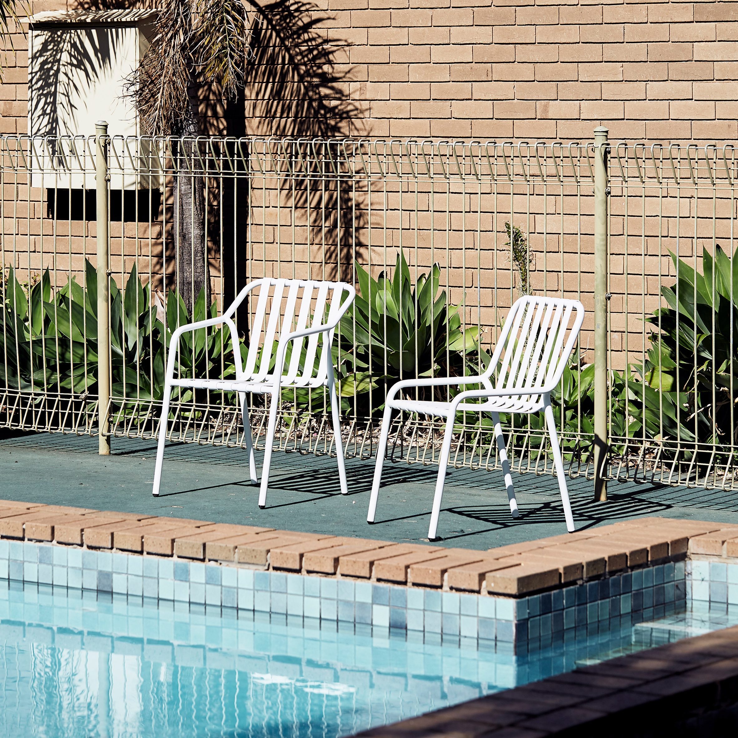 White chairs by pool