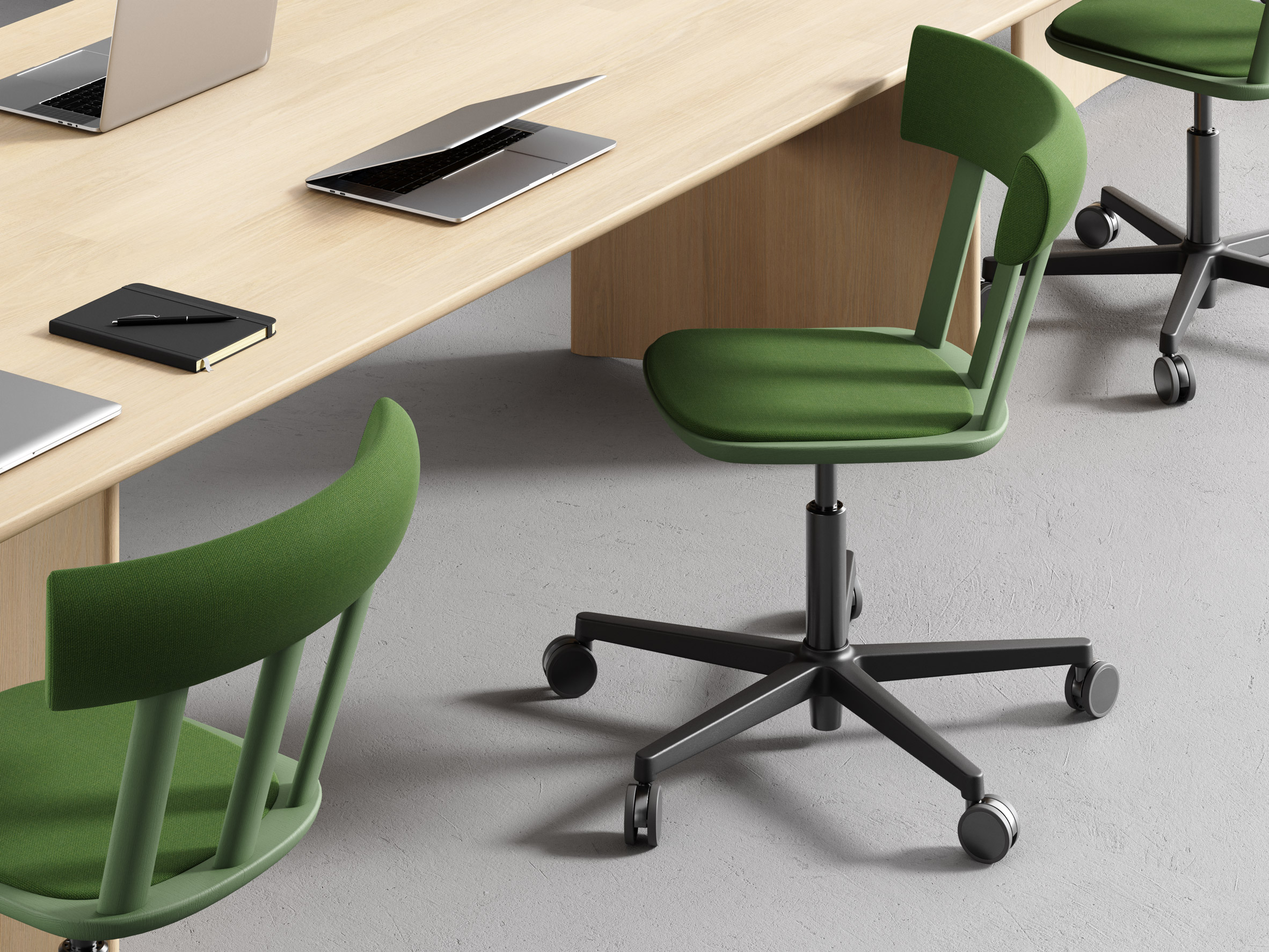 Green swivel chair in front of desk