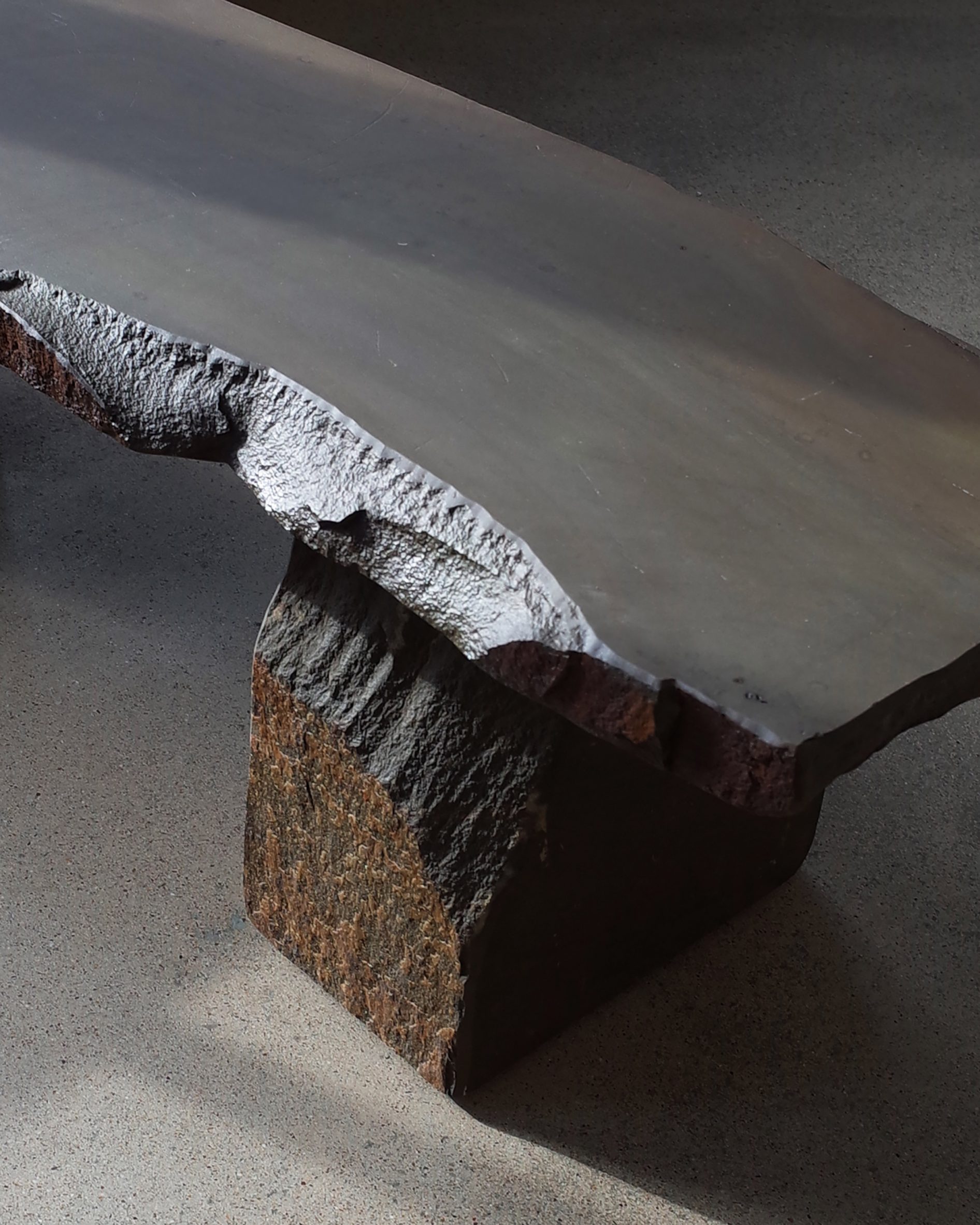 Dark-hued textured bench