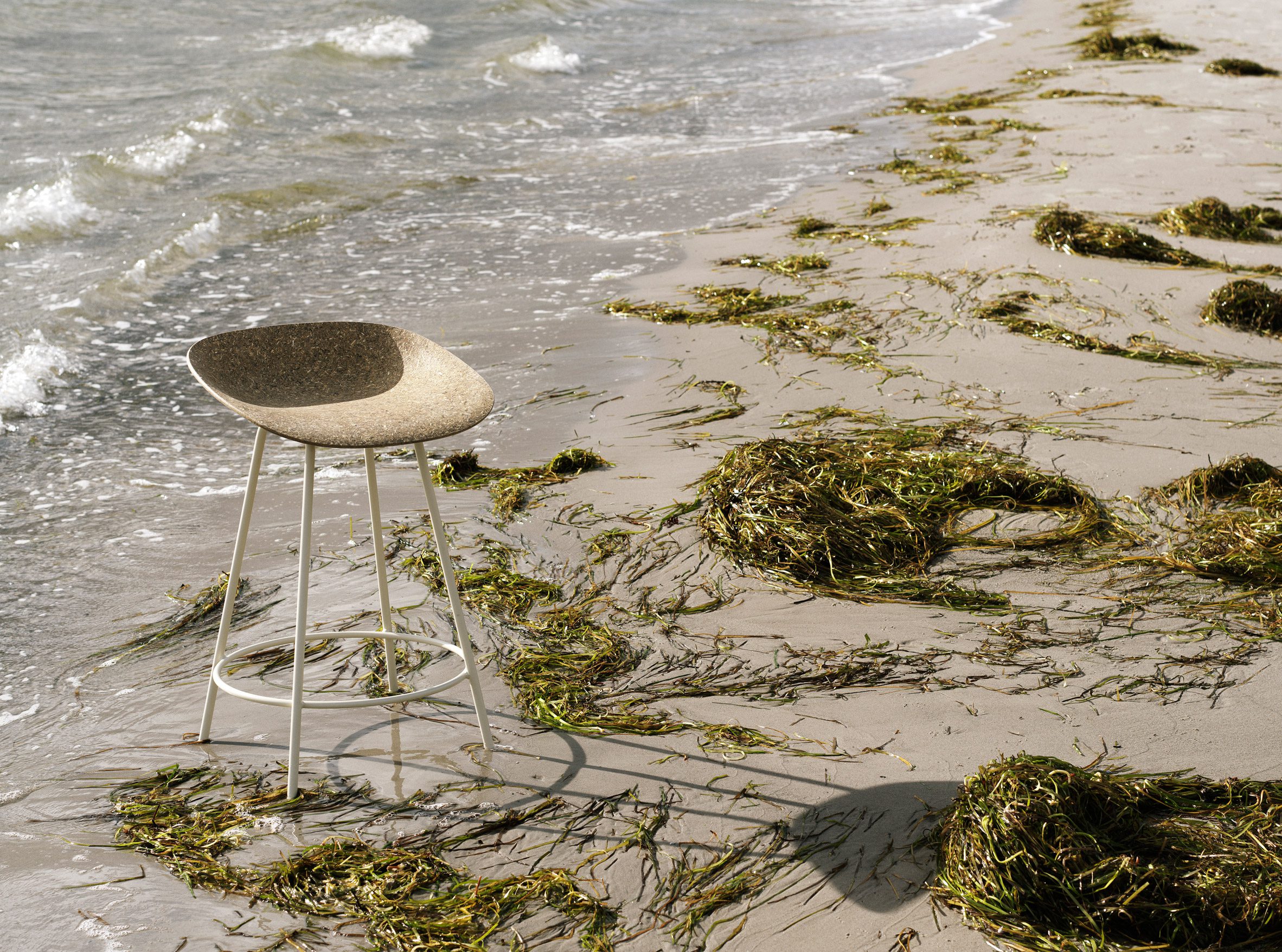 Mat eelgrass chair by Foersom & Hiort-Lorenzen and Norman Copenhagen on a beach
