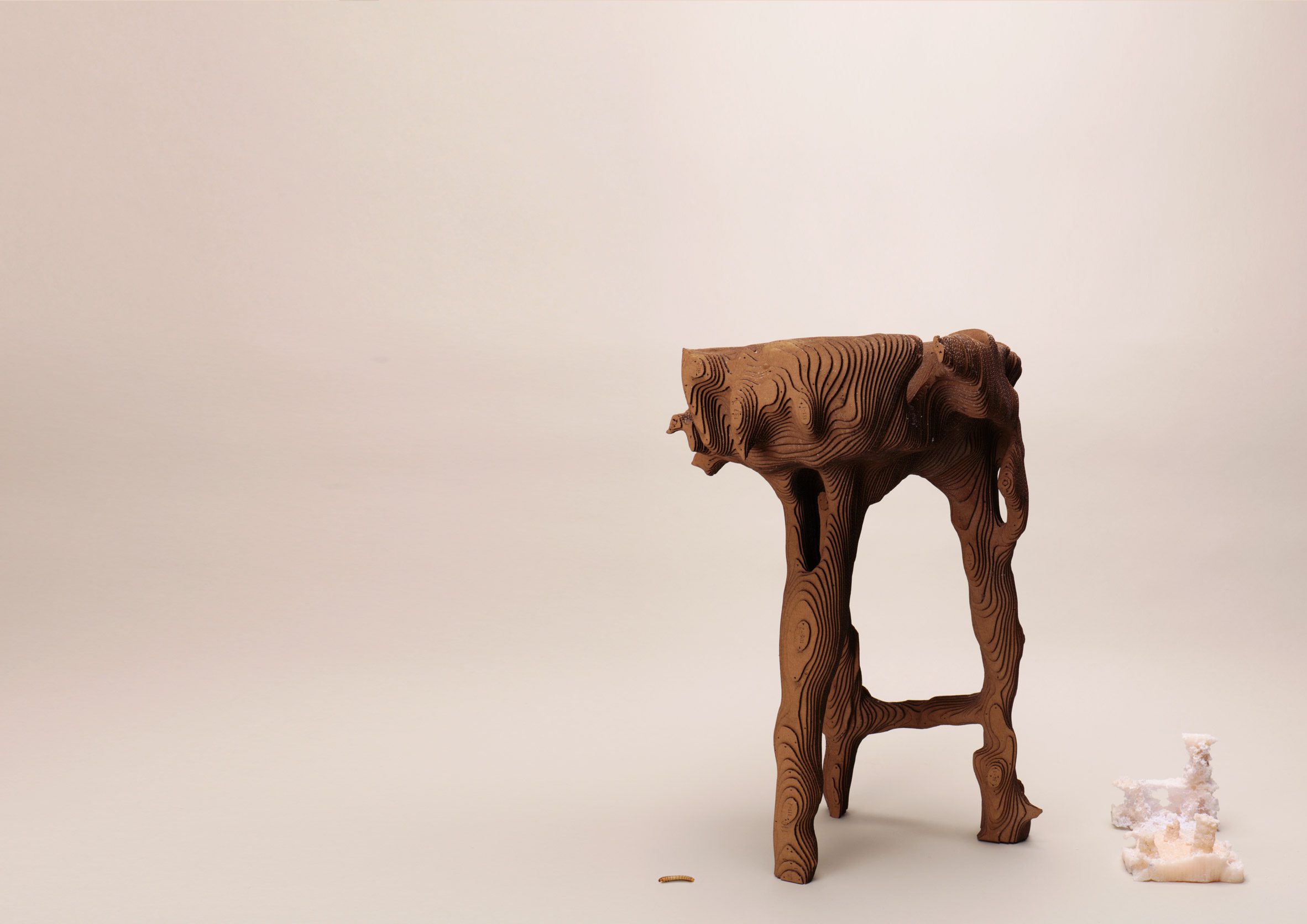 Photo of William Eliot's Digested Objects stool prototype, made of slices of brown cardboard glued together