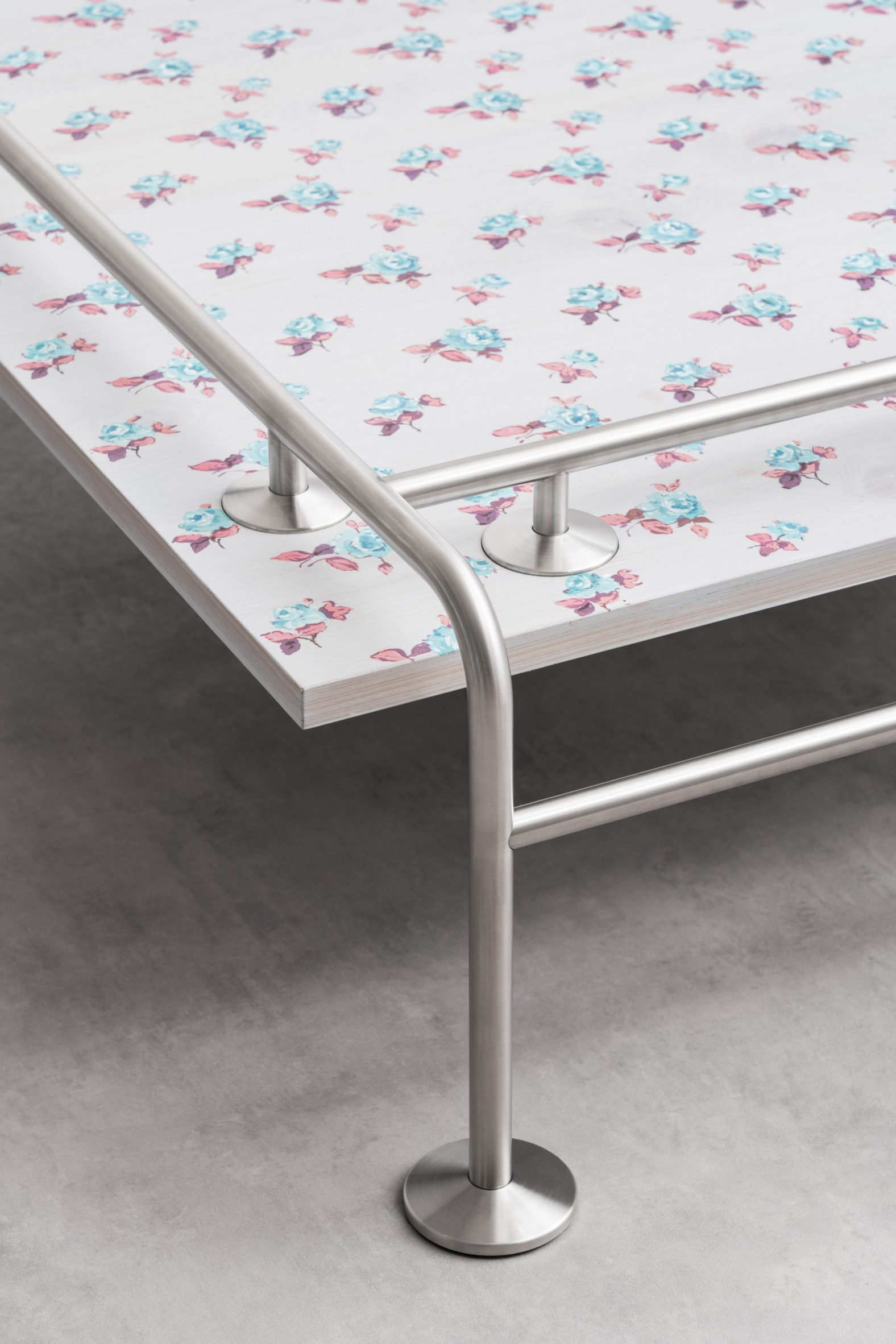 Floral-print table with metal tubular legs