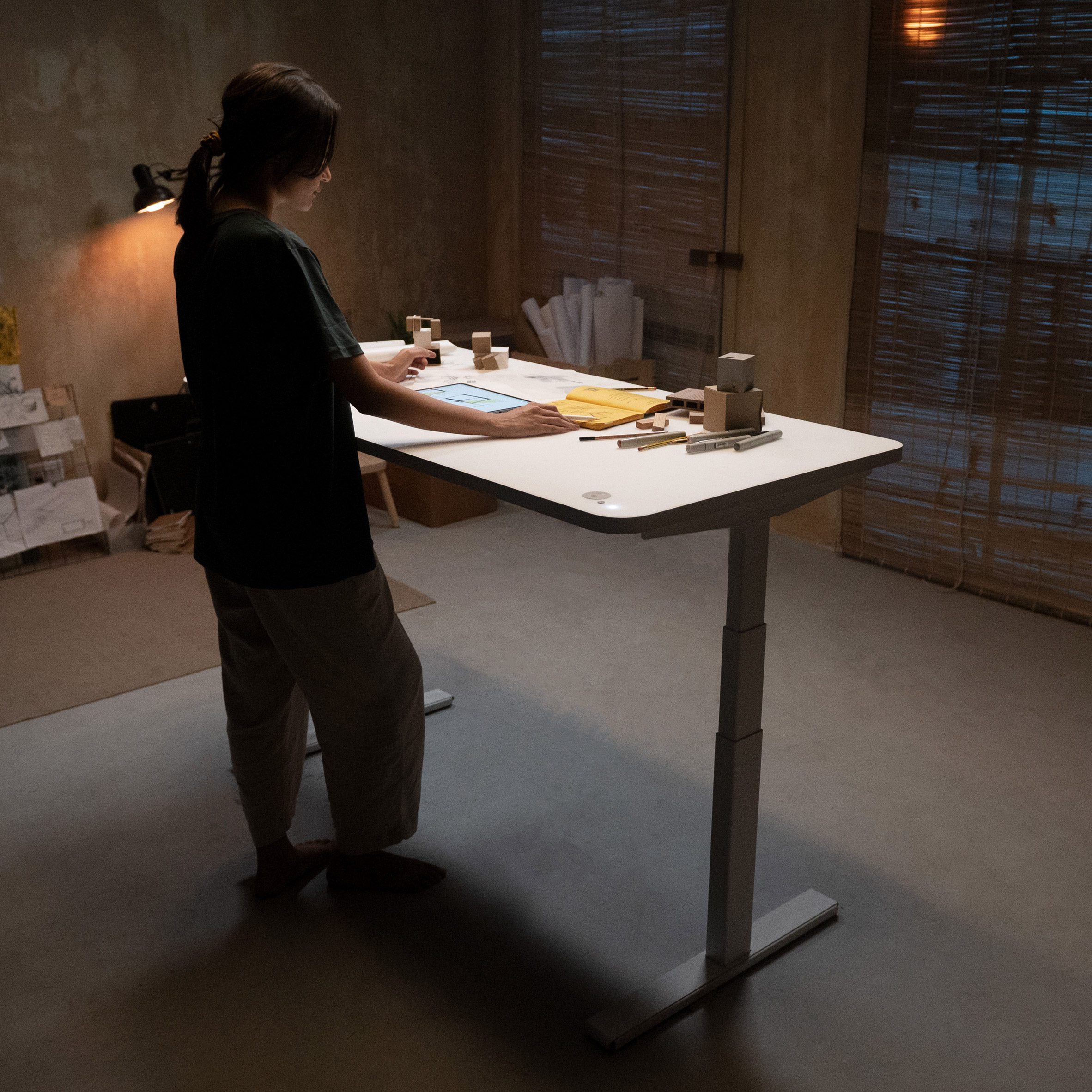 Woman working at an adjustable standing desk