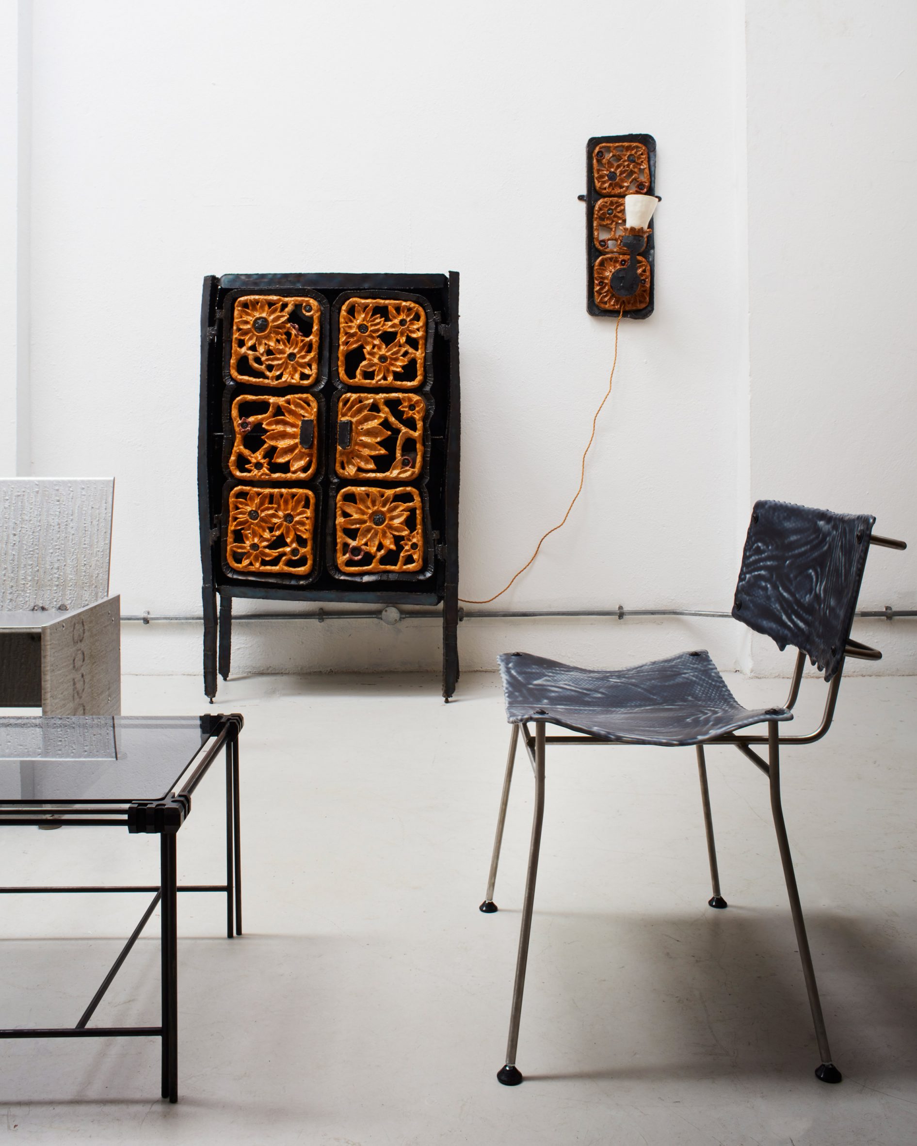 Chair and glass table in London gallery