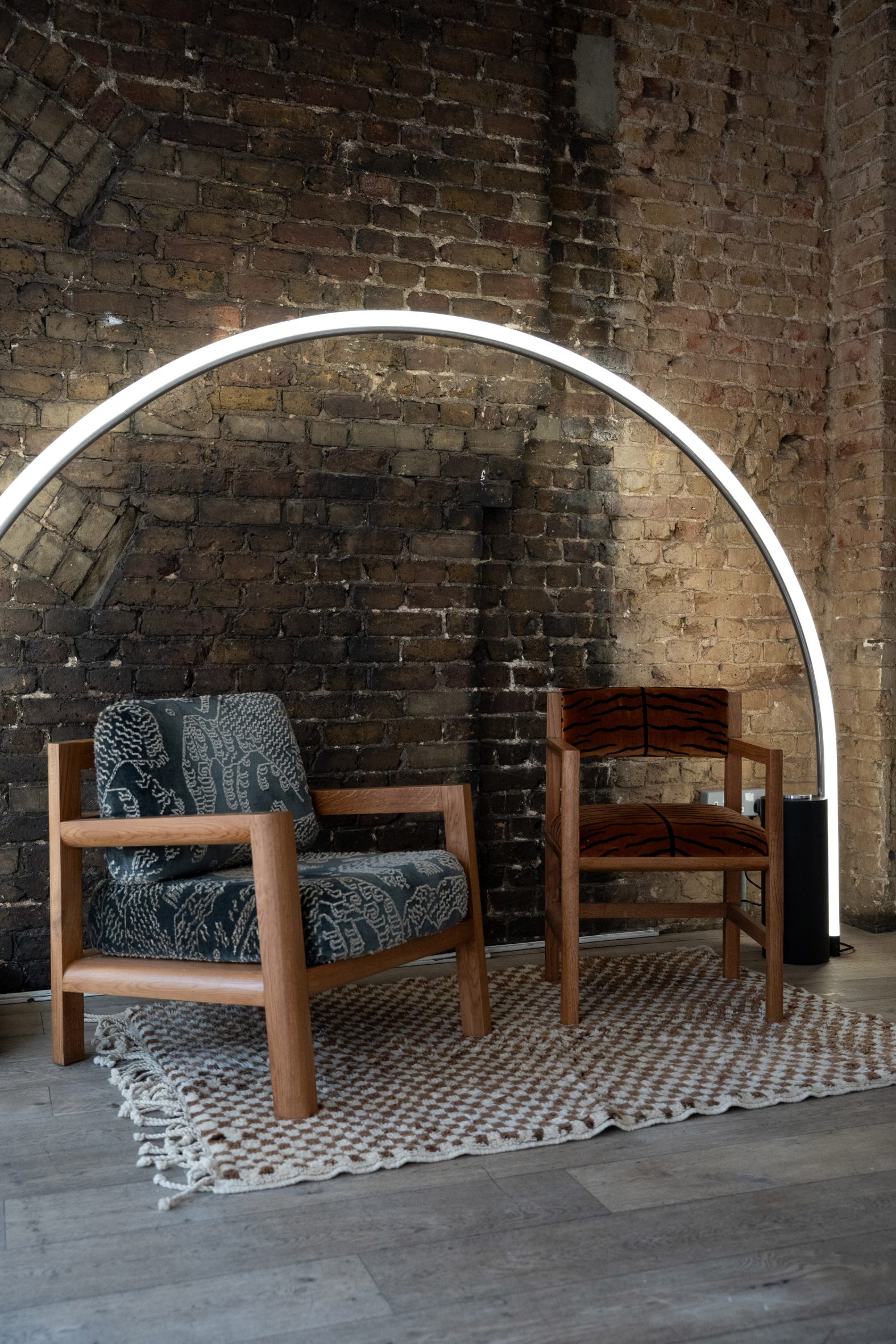 Chairs by Dean Connell and light by Joe Slatter in a brick room