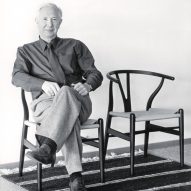 Hans J Wegner on a CH24 Wishbone Chair