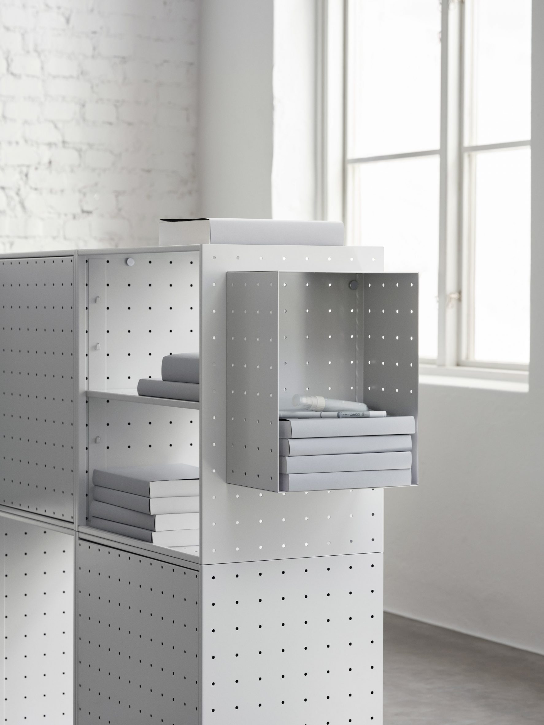 Grey shelves by String Furniture